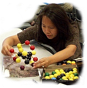 student with molecular model