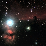 IC 434, 
the Horsehead Nebula (center), and NGC 2024, the Flame Nebula (bottom 
left, near the bright star Zeta Orionis, or Alnitak)